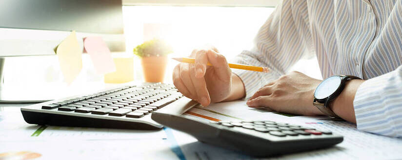 Image of Professional Bookkeeper with a calculator
