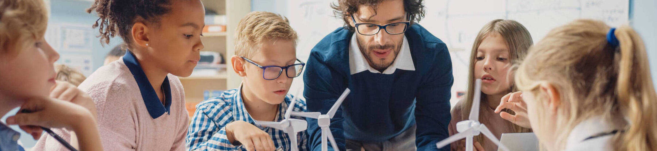 Image of science teacher with elementary students